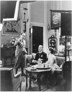 Sidney Franklin (standing) on the set of The Last of Mrs. Cheyney