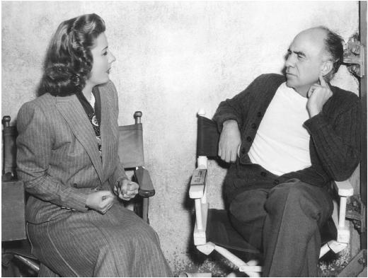 Gregory La Cava and Irene Dunn on the set of Unfinished Business