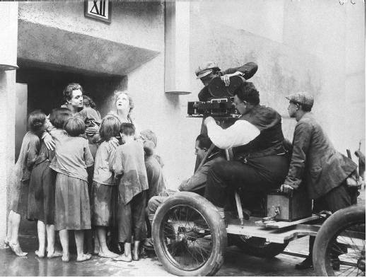 Fritz Lang (seated below camera) on the set of Metropolis