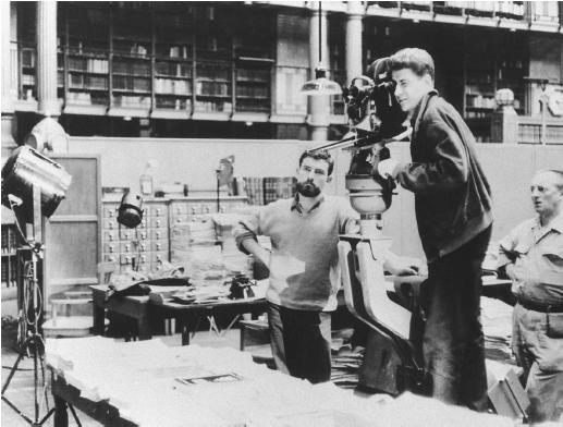 Alain Resnais (behind camera) on the set of Toute la mémoire du monde