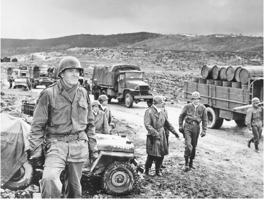 Robert Ryan (center) and Henry Fonda (foreground) in Battle of the Bulge