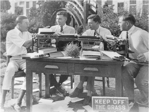 Clyde Bruckman (second from left) with Hugh Fay, Hunt Stromberg, and David Kirkland